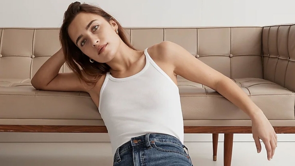 woman wearing white tank womens top and jeans